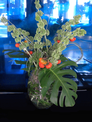 FLOWERS: bells of ireland, miniature pumpkins, monstera leaf FLOWERS: bells of ireland, miniature pumpkins, monstera leaf